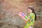 Beautiful Asian women hold plastic water guns at an ancient temple during Songkran, the most beautiful and fun water festival in