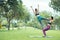 Beautiful Asian women practicing Acroyoga in park