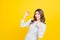 Beautiful Asian women smile happyness holding fresh orange slide with a yellow background.Squeeze Fresh oranges healthy fruits tha