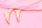 Beautiful Asian Young Woman Body Legs and Feet on The Pastel Pink Bedroom Background. Female Foot in Bed Sleep Relax.