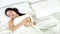 Beautiful asian young woman sleeping lying in bed with head on pillow comfortable and happy moving panning camera.