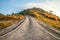 Beautiful asphalt country road side on the green mountain background in morning sunlight, Phetchabun Thailand. Road trip, travel