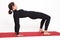 Beautiful athletic girl in a black suit doing yoga. Purvottanasana asana plank pose. on white background.