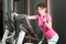 Beautiful athletic woman doing cardio exercises on stepper