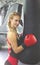 Beautiful athletic woman in the gym is engaged in boxing. life style