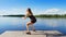 Beautiful, athletic young blond woman stretching, doing different exercises, jumping, lunges, squats. Lake, river, blue