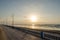 Beautiful Atlantic beach promenade with stone walkway during sunset at Sidi Ifni, Morocco, North Africa