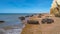 Beautiful Atlantic coastline in peninsula Valdes at low tide with alga, seashells and caves, Patagonia, Argentina