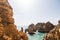 Beautiful atlantic ocean view horizon with sandy beach rocks with stairs on beach on Atlantic ocean in Portugal