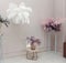 Beautiful, atmospheric interior of room, hall. Decorative flowers on stands, a vase, bust, table and feather decoration will