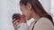 Beautiful Attractive Asian mom holding baby newborn in hand and kissing on baby head sweet lovely.Happy mother and infant baby