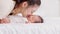 Beautiful Attractive Asian mom  kissing on baby cheek sweet and lovely.Happy mother and infant baby looking together smile with