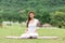 Beautiful Attractive Asian woman sitting on yoga mat practice Baddha Padmasana or Bound lotus pose with yoga meditation relax and