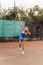 Beautiful, attractive, charming, slender, athletic woman tennis player actively plays tennis on the court. Favorite sport. Grace