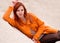 Beautiful, attractive, sexual, seductive, red-haired girl with red sweater, hair.