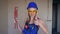 Beautiful attractive woman plumber shows thumb up