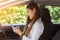 Beautiful attractive young woman smile in casual sitting in car using smartphone open GPS navigation app