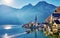 Beautiful autum landscape of Hallstatt mountain village with Hallstatter lake and boat in Austrian Alps.