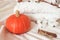 Beautiful autumn atmospheric hygge card. Cozy soft autumn background with pumpkin, cinnamon, warm knitted sweater and