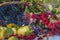 Beautiful autumn composition with ripe fruits and bunch of flowers