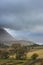 Beautiful Autumn Fall landscape view along valley towards Mellbreak and Grasmoor in Lake District with vibrant epic lighting in