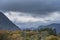 Beautiful Autumn Fall landscape view along valley towards Mellbreak and Grasmoor in Lake District with vibrant epic lighting in