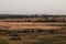 Beautiful autumn field. Majestic open space under dramatic clouds. Steppe