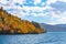 Beautiful autumn foliage scenery landscapes. View from Lake Towada sightseeing Cruise ship