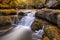 Beautiful autumn foliage and waterfall