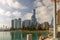 A beautiful autumn landscape along Lake Michigan with skyscrapers, hotels and office buildings in the city skyline, green water