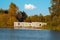 Beautiful autumn landscape with floating cabins on the lake and autumnal trees