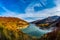 Beautiful autumn landscape with golden colored trees on the shores of Siriu lake