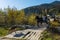 Beautiful autumn landscape with a horse cart on the wooden bridge in Carpathian mountains