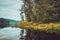 Beautiful autumn landscape with lake, pine trees, natural stone coast in the Republic of Karelia, Ladoga , northern