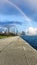 A beautiful autumn landscape at Lakefront Park with the rippling blue waters of Lake Michigan, autumn trees, people walking