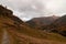 Beautiful autumn landscape with a path towards a group of chaltes in Zermatt area