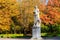 Beautiful autumn landscape in Pavlovsk park with the allegory sculpture Peace with a lion at his feet, Pavlovsk, Saint