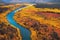 Beautiful autumn landscape in red yellow tones with brilliant mountain river