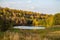 Beautiful autumn landscape in the wilderness with a body of water and forest in the background