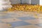 Beautiful autumn leaves on the veranda of the house with a column in the yard.