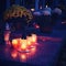 Beautiful autumn night concept. Cemetery and Halloween. Candle in the grave. Background for Halloween.