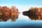 Beautiful autumn park. Autumn in Minsk. Autumn trees and leaves. Autumn Landscape.Park in Autumn. Mirror reflection of trees in wa