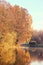 Beautiful autumn park. Autumn in Minsk. Autumn trees and leaves. Autumn Landscape.Park in Autumn. Mirror reflection of trees in wa