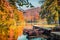 Beautiful autumn scenery. Stunning morning view of pure water lake with boats in Plitvice National Park.