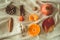 Beautiful autumn seasonal background. Autumn assortment pine cone cotton, mandarin, walnut, cinnamon, leaves, physilis pomegranate