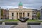 Beautiful autumn view of The Clock Tower building and The Wishing Hand sculpture at courtyard of Department of Education