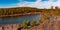 Beautiful autumn view of the iron mine lake colored red at Bad Muskau Park, Poland site