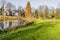 Beautiful autumn view of a lake surrounded by green grass and trees