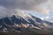 Beautiful autumn volcanic landscape - view of snow-capped cone of stratovolcano Bolshaya Udina Volcano in Klyuchevskaya