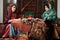 Beautiful azeri women and novruz tray with traditional pastry shekerbura and pakhlava